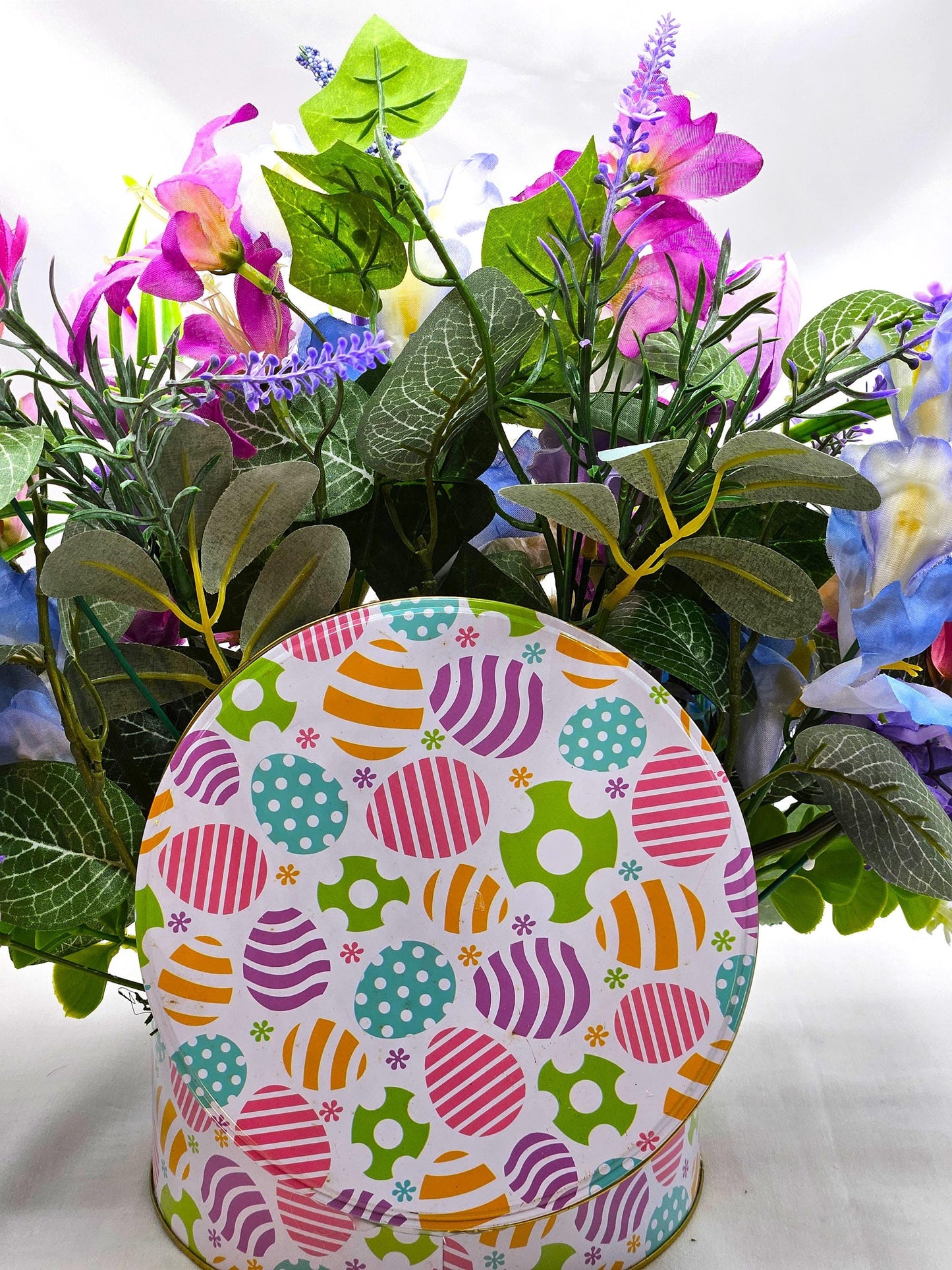 Large Easter Egg Tin with Vintage Rabbit Holding an Egg and Sitting amidst Purple/Lilac Lilies/Tulips and Blue Hyacinths