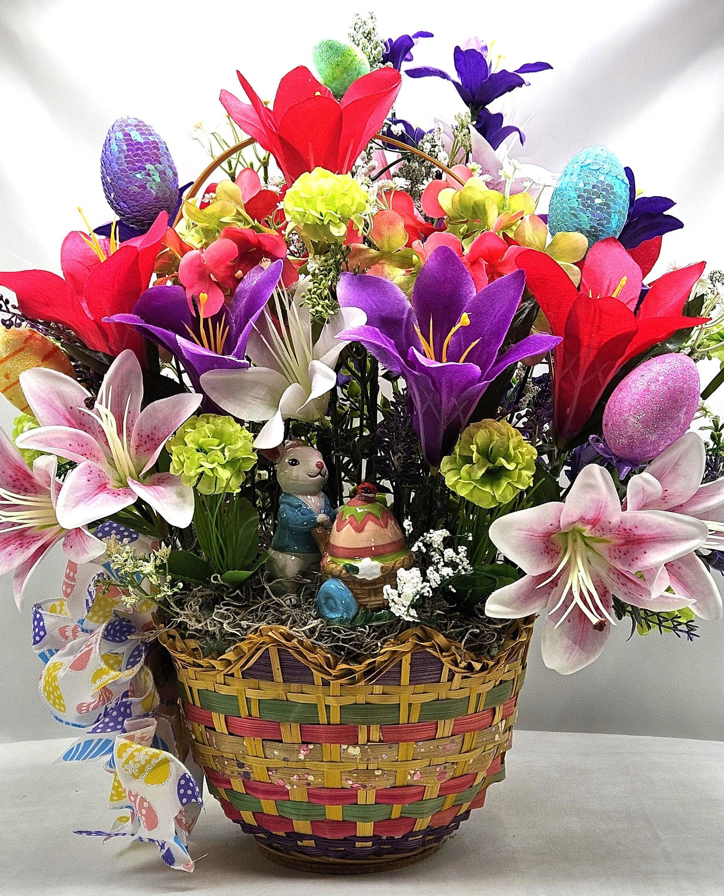 Exquisite Multi-Colored Scalloped Easter Basket w/Lovely Glittery Bow/A Variety of Lilies in Basket/Rabbit Pushing Cart/Other Easter Accents