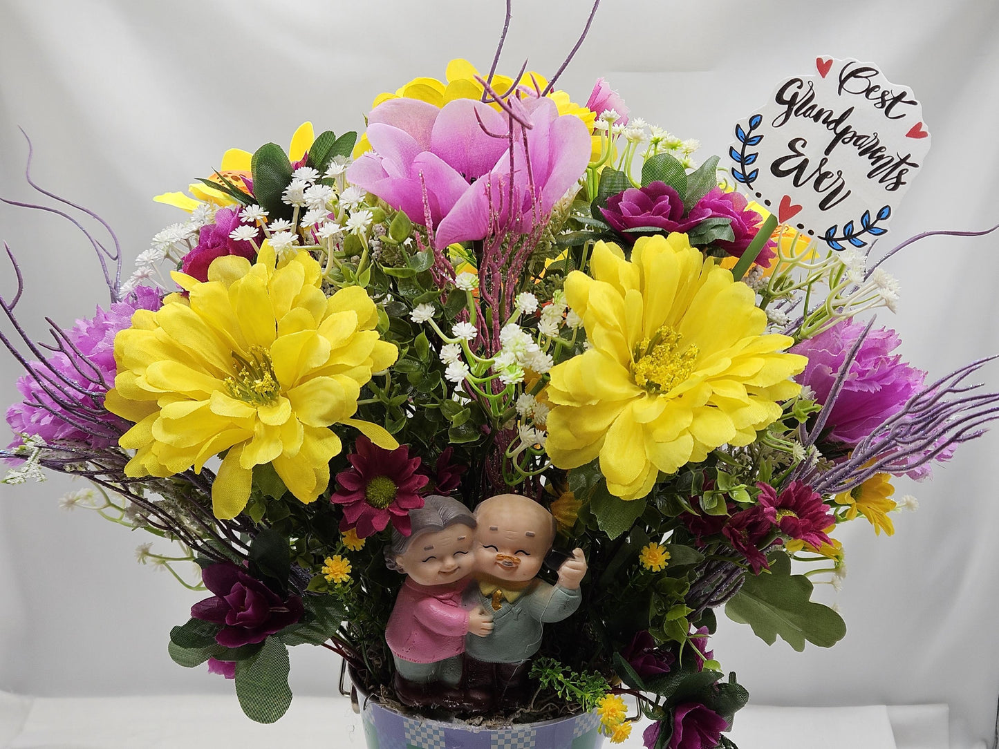 For The Special Grandma and Grandpa/Floral Design in Simple Blue Pail/Grandparents Figures at the Front of Colorful Yellow/Pink Flowers Plus