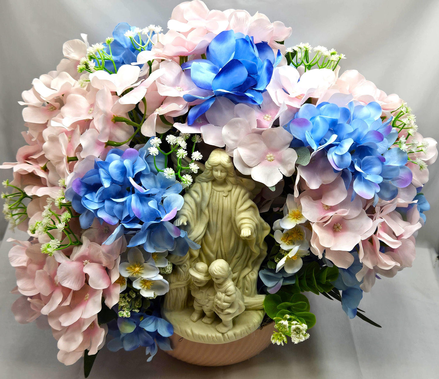 Floral Centerpiece/Guardian Angel With Little Children Amidst A Garden Of Pink And Blue Hydrangea Flowers/Greens/Baby's Breath/Lovely