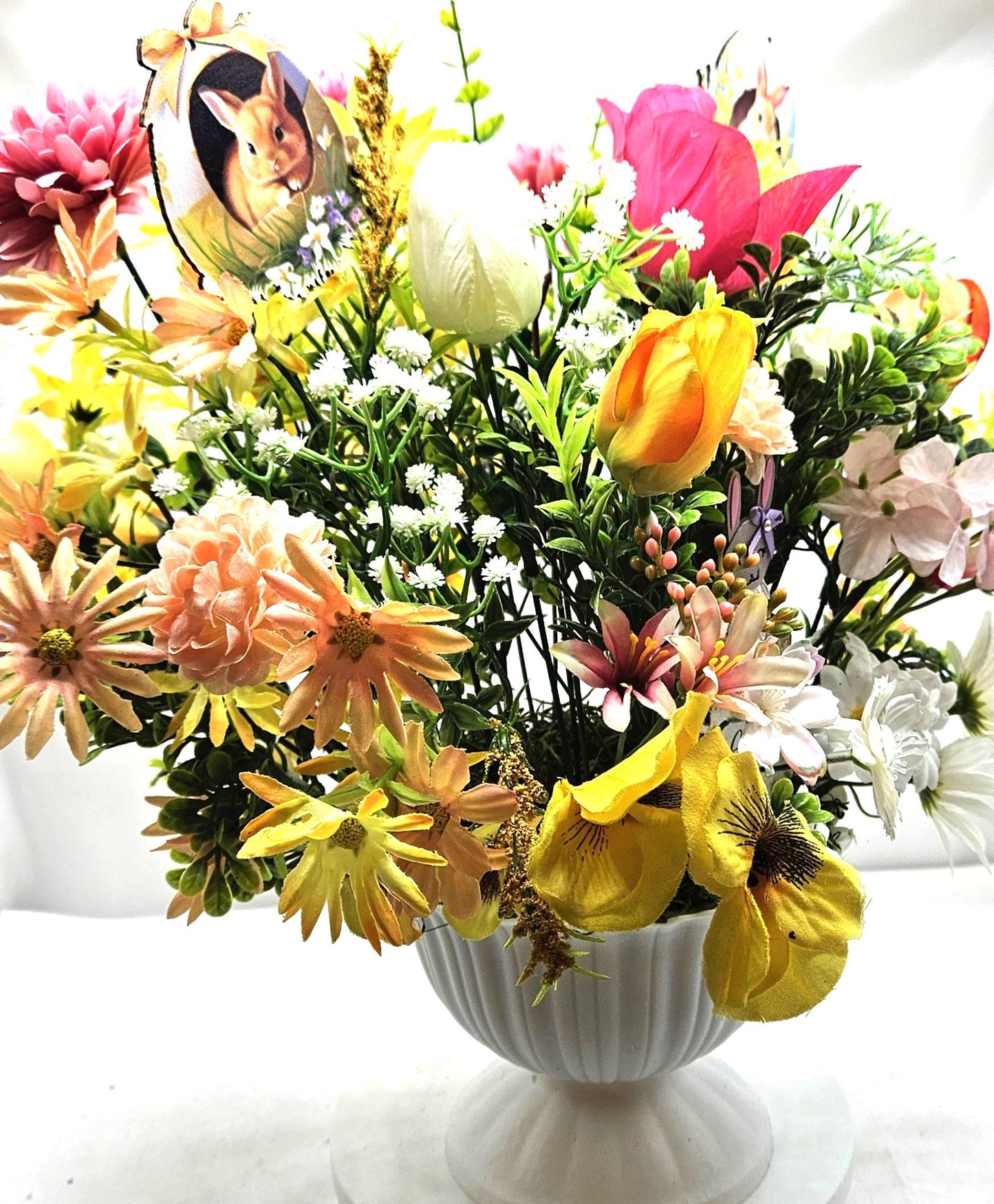 Cheery Hello Spring Floral with Cute Rabbits, Pansies, Daisies, Tulips and Other Vibrant Wildflowers in an Elegant Plastic Footed Bowl