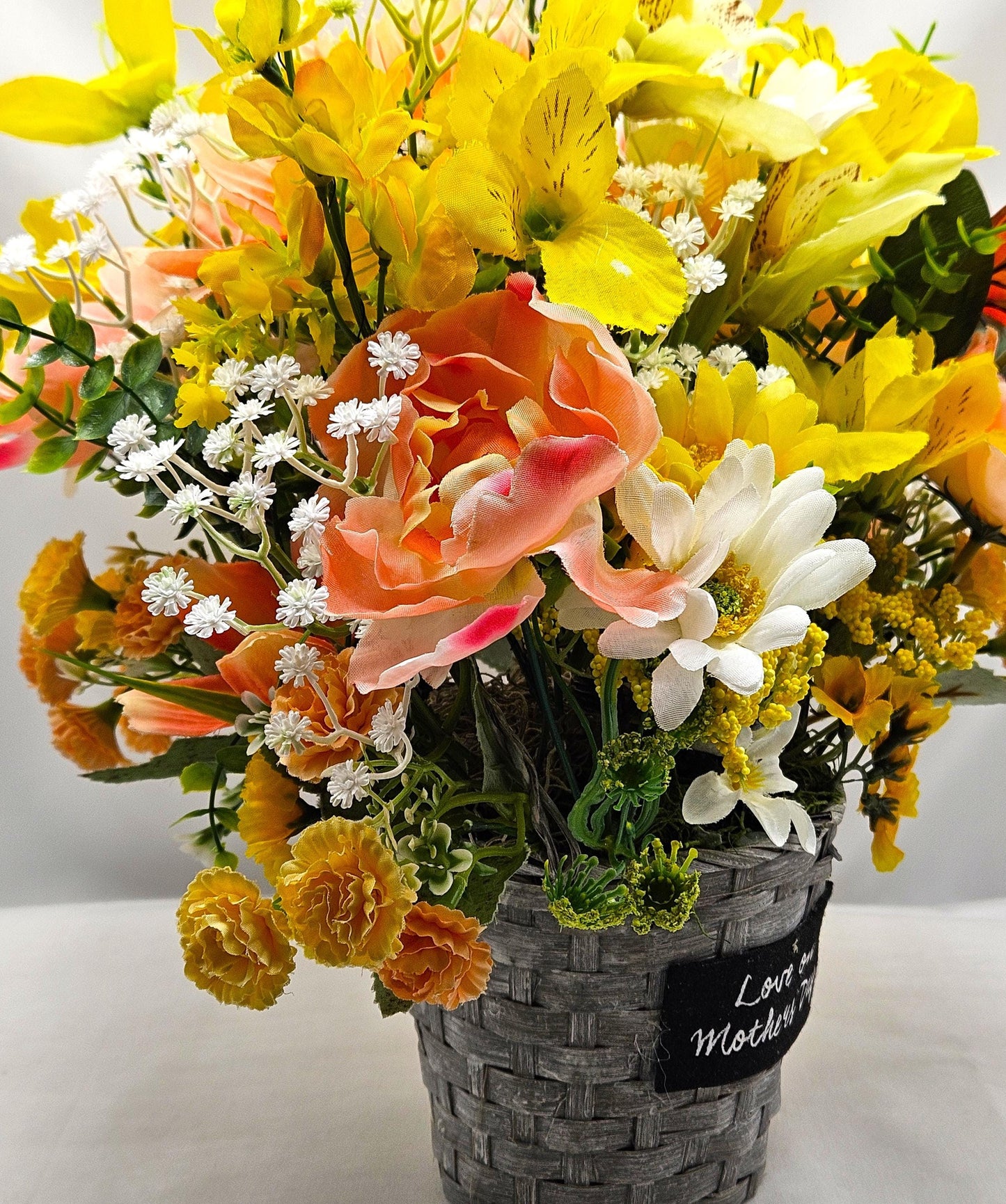 Mother's Day Bouquet in Wicker Type Pot/Love on Mother's Day/Featuring a Cheerful Bird in a Garden of Vibrant Yellow/Peach Flowers/Butterfly