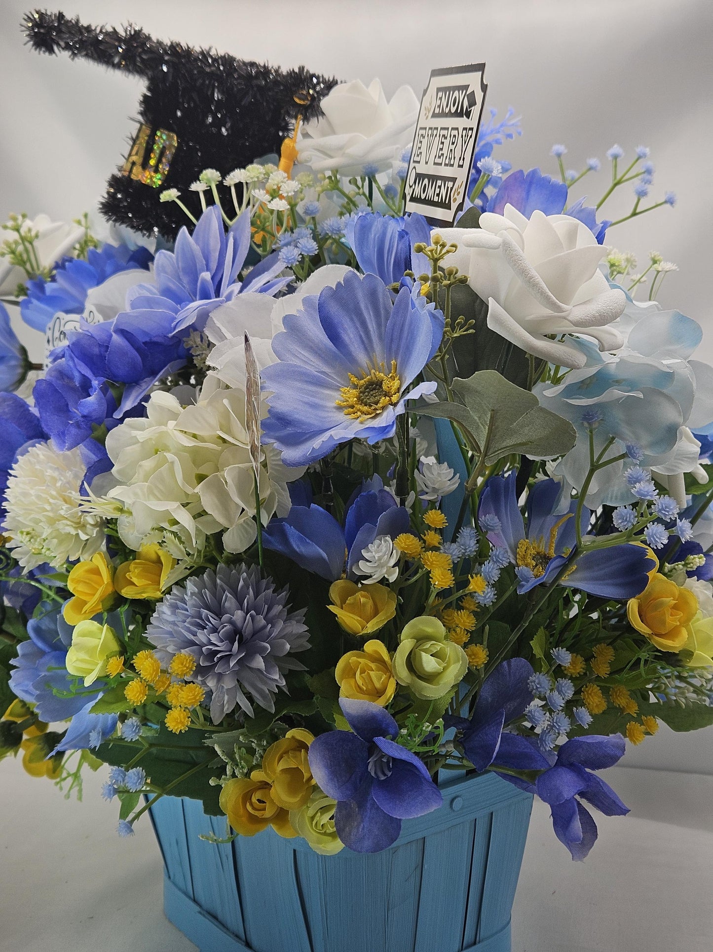Graduation Floral Centerpiece/Blue Wood Basket/Blue/White/Yellow Flowers/Graduation Hat/Congratulations Messages/Roses/Dahlias/Pansies Plus