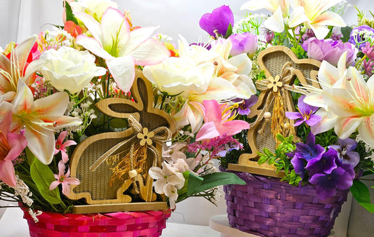 Bright Blue or Pink Easter Basket With Wooden Rabbit Accents in front of Vibrant Pin/White or Purple/White Lily Garden