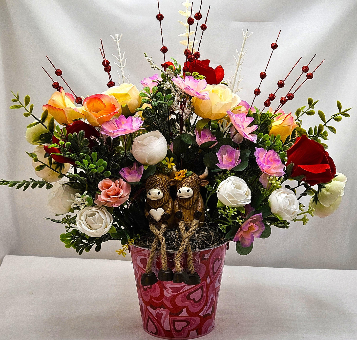 Adorable Cow Couple, Cuddled together and Sitting in a Rose and Glitter Accented Garden, And all Set in a Heart-dorated Pail, Great Romance