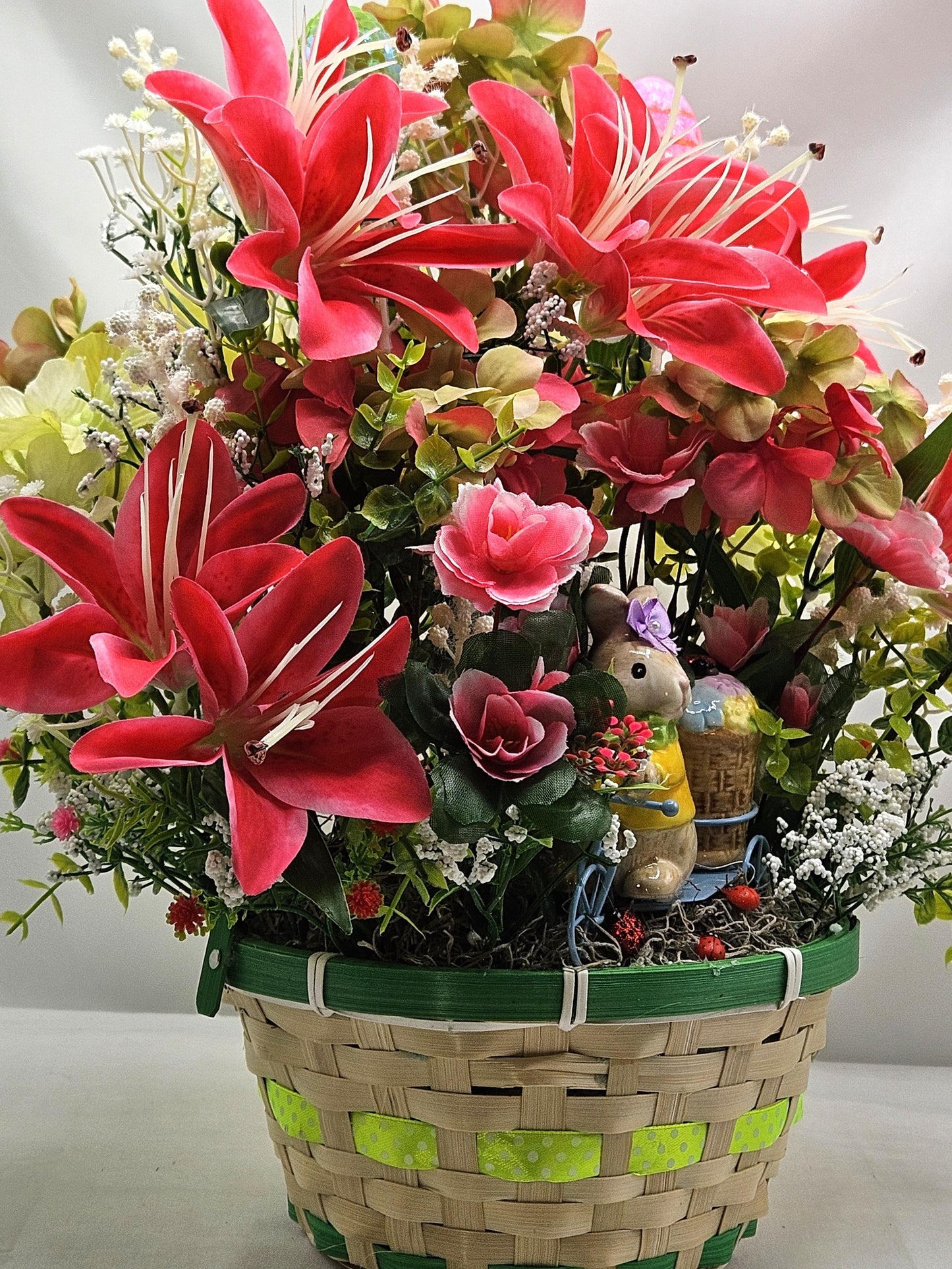 Whimsical Easter Basket/Rabbit in Bike Carrying Goodies/Accented W/cute Ladybugs/Hot Pink Lilies/Other florals/pink/green/Greens/Baby Breath