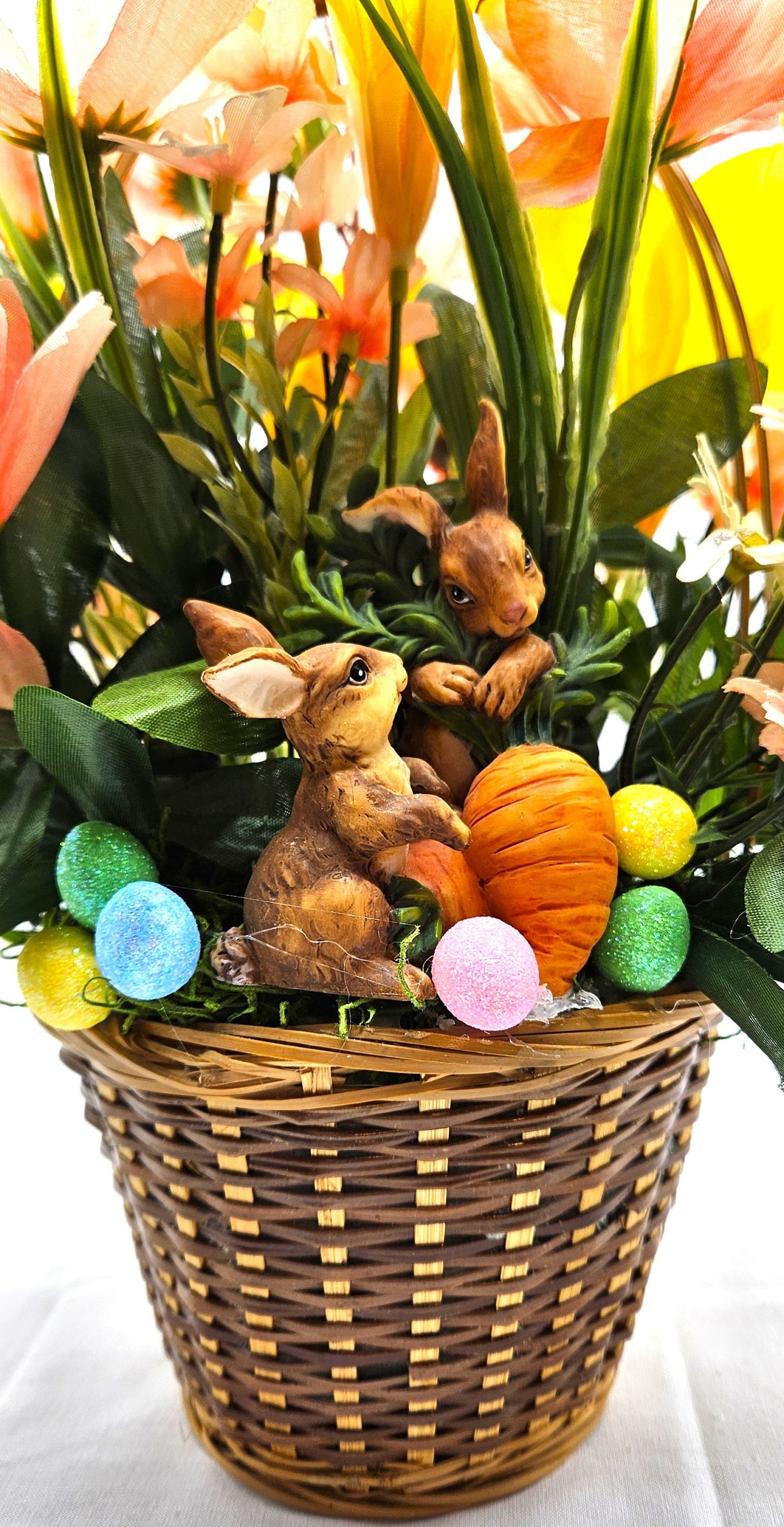 Charming Spring/Summer Flower Arrangement in Wicker Basket with Ceramic Bunnies with Carrot, Glitter, Pastel Flowers