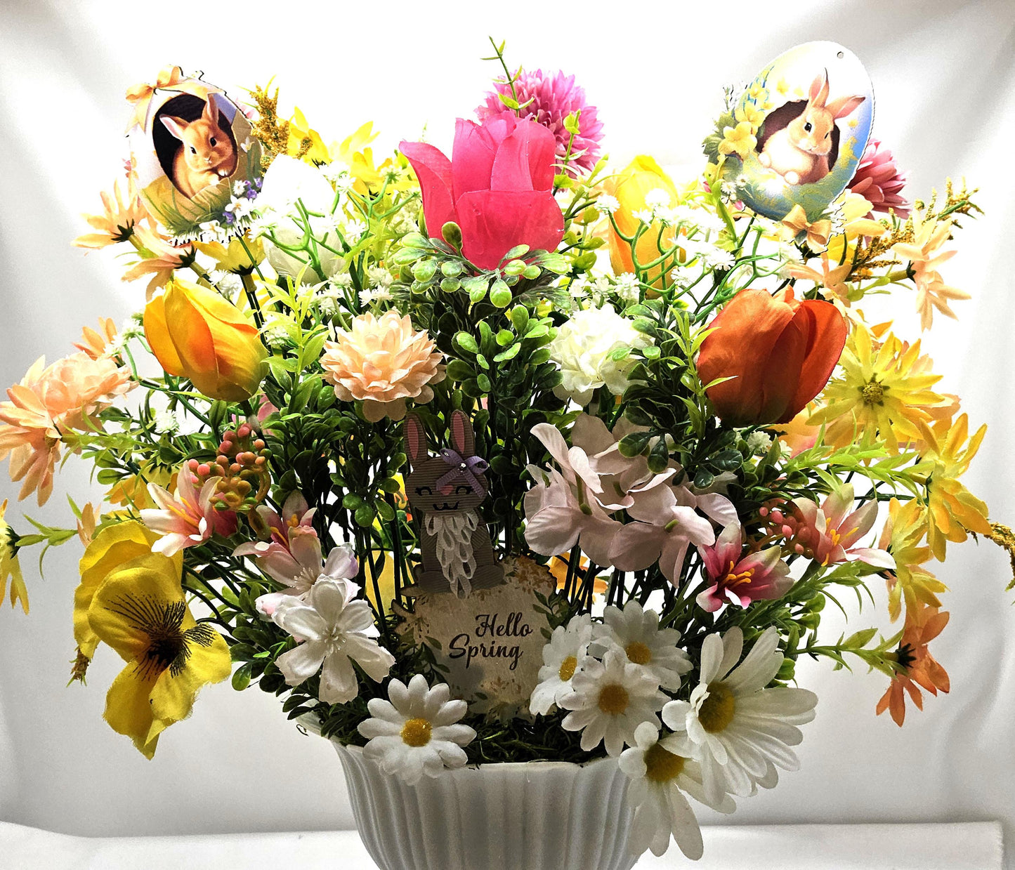 Cheery Hello Spring Floral with Cute Rabbits, Pansies, Daisies, Tulips and Other Vibrant Wildflowers in an Elegant Plastic Footed Bowl