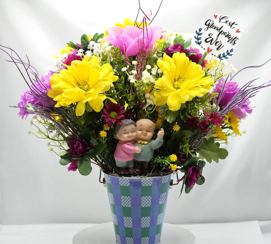 For The Special Grandma and Grandpa/Floral Design in Simple Blue Pail/Grandparents Figures at the Front of Colorful Yellow/Pink Flowers Plus