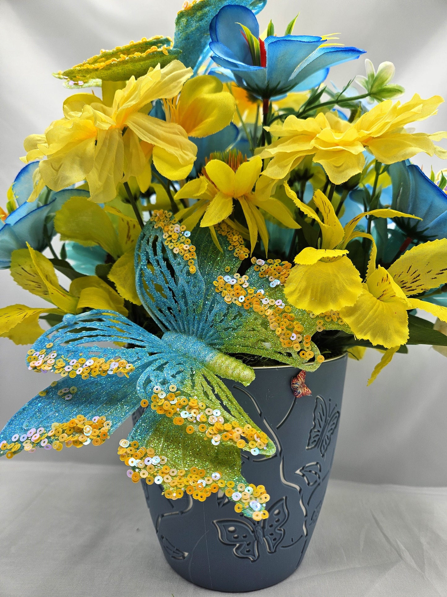 Butterfly Flower Arrangement, Sparkling Butterflies and Florals in Decorated Butterfly Pot, Yellow/Teal Blue Flowers & Butterfly Accents