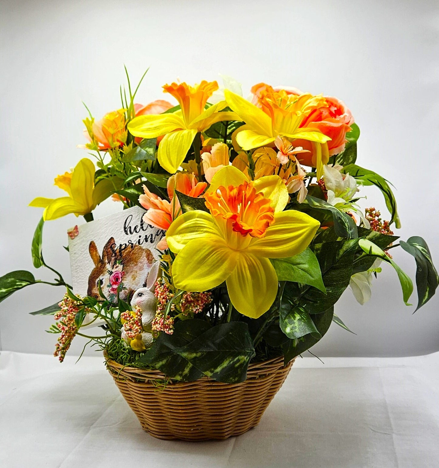 Hello Spring Flower Arrangement Featuring Cute Bunnies Amidst Daffodils, Cosmos, Peonies and Other Spring Flowers and Greenery