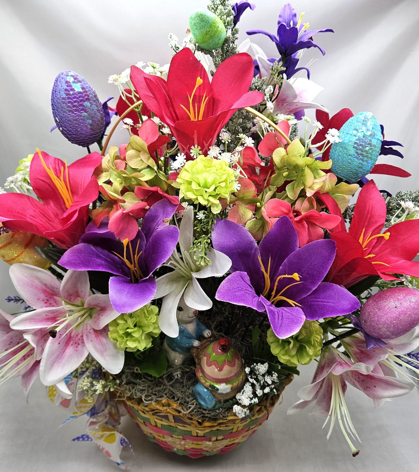 Exquisite Multi-Colored Scalloped Easter Basket w/Lovely Glittery Bow/A Variety of Lilies in Basket/Rabbit Pushing Cart/Other Easter Accents