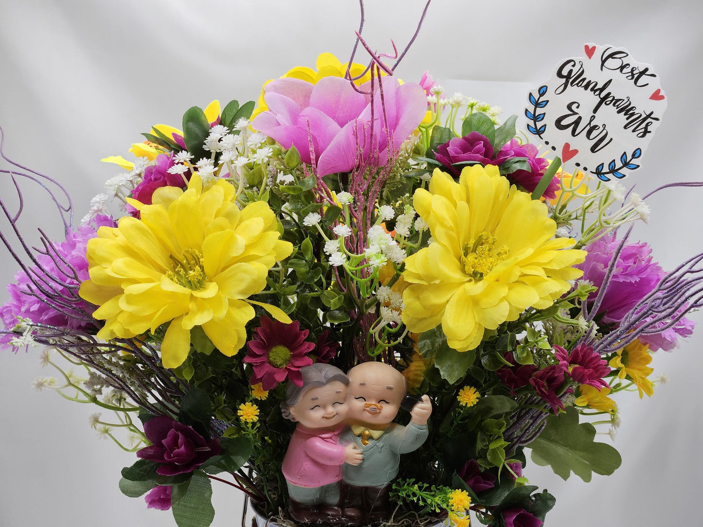 For The Special Grandma and Grandpa/Floral Design in Simple Blue Pail/Grandparents Figures at the Front of Colorful Yellow/Pink Flowers Plus