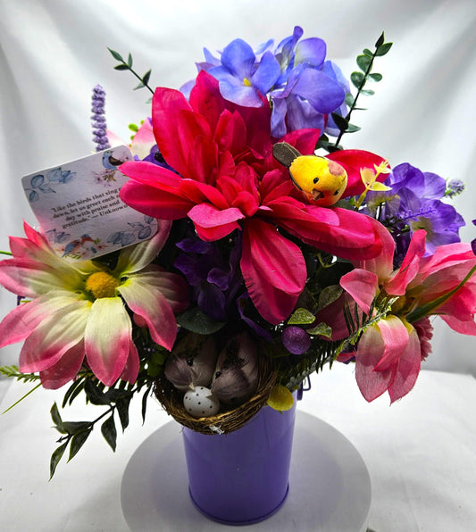 Charming Thinking Of You Bouquet set in a light purple container and accented with birds in a nest and/Atop Flowers/Pink/White/Blue/Greenery