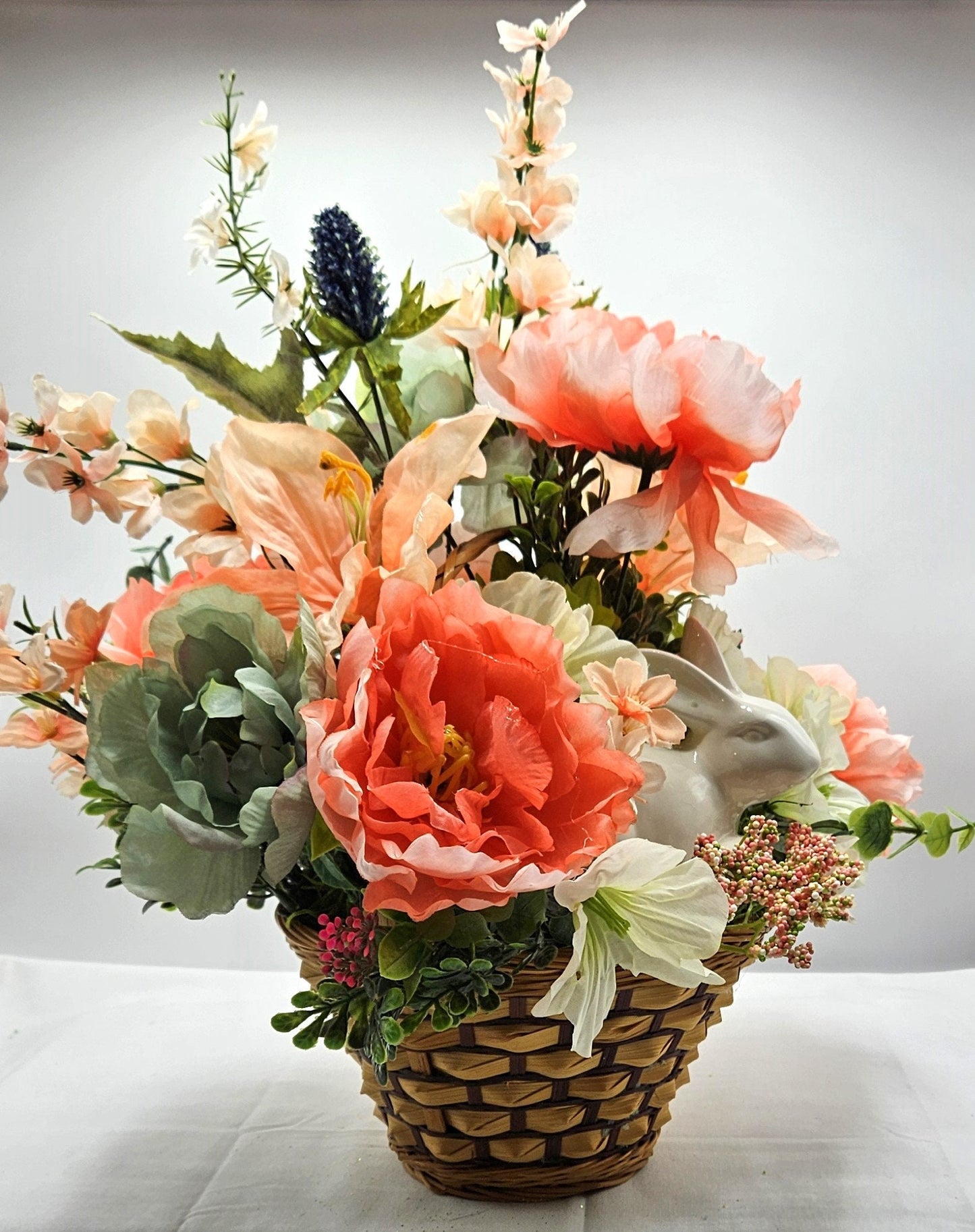 Elegant Spring Centerpiece with Bunny in Wicker Basket,  Peach and Jade Colored Peonies, Petunias and other Spring Flowers