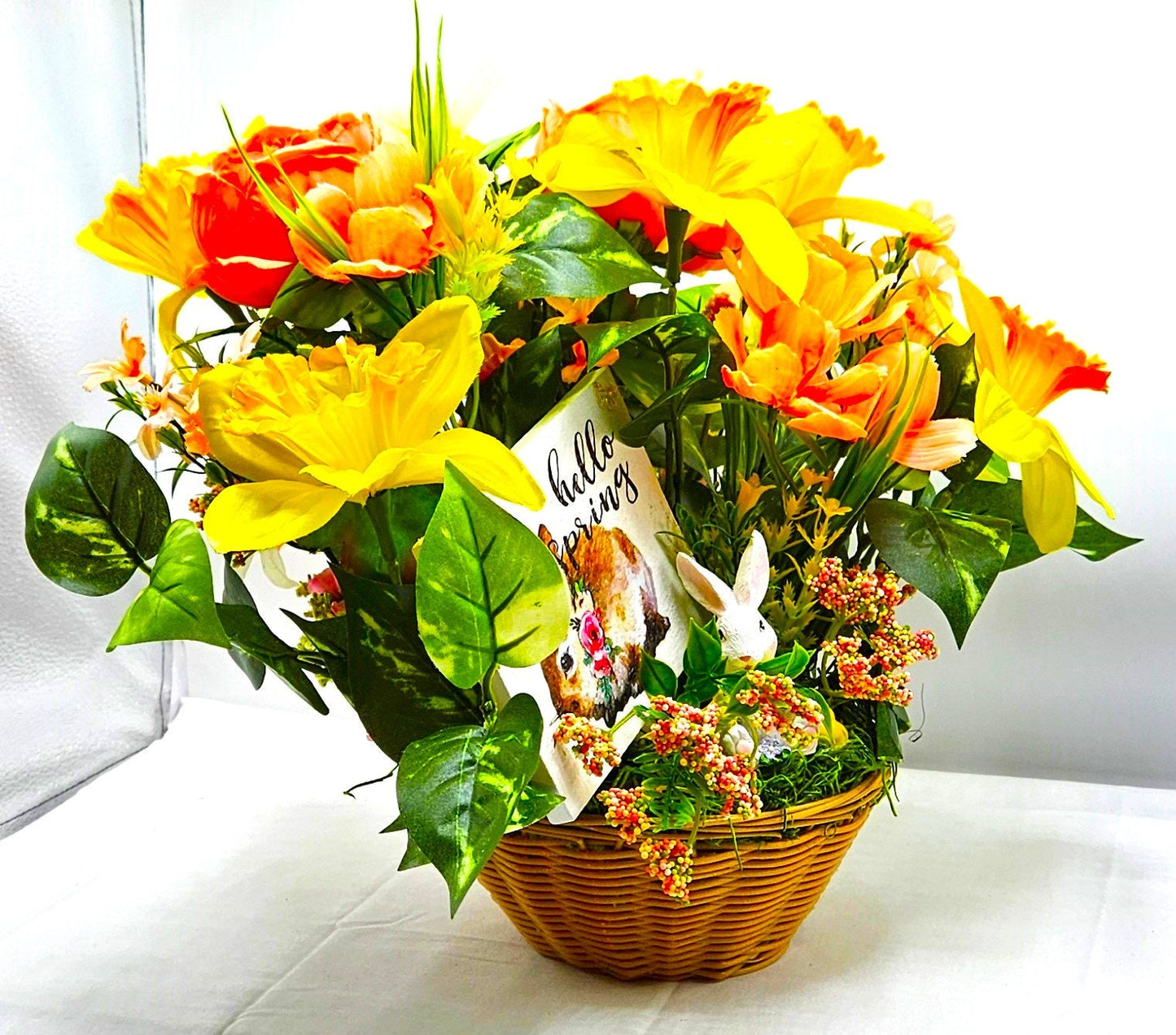 Hello Spring Flower Arrangement Featuring Cute Bunnies Amidst Daffodils, Cosmos, Peonies and Other Spring Flowers and Greenery