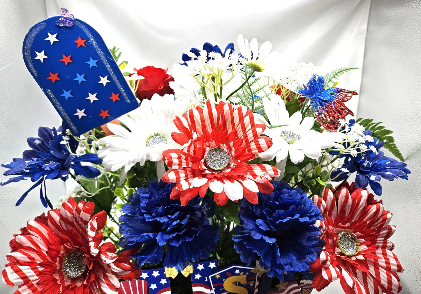 Gnome in the USA Patriotic Flower Arrangement, Oval Wicker Basket, Red White Blue Daisies, Sunflowers, Carnations