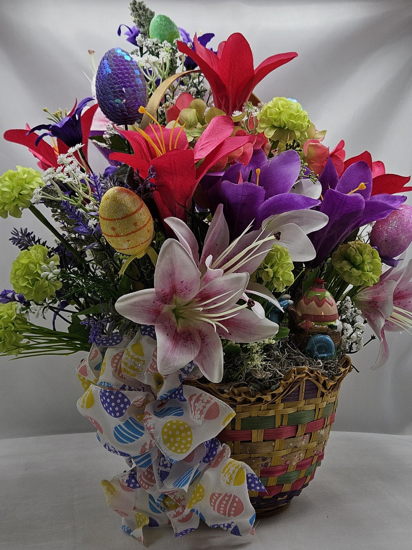 Exquisite Multi-Colored Scalloped Easter Basket w/Lovely Glittery Bow/A Variety of Lilies in Basket/Rabbit Pushing Cart/Other Easter Accents