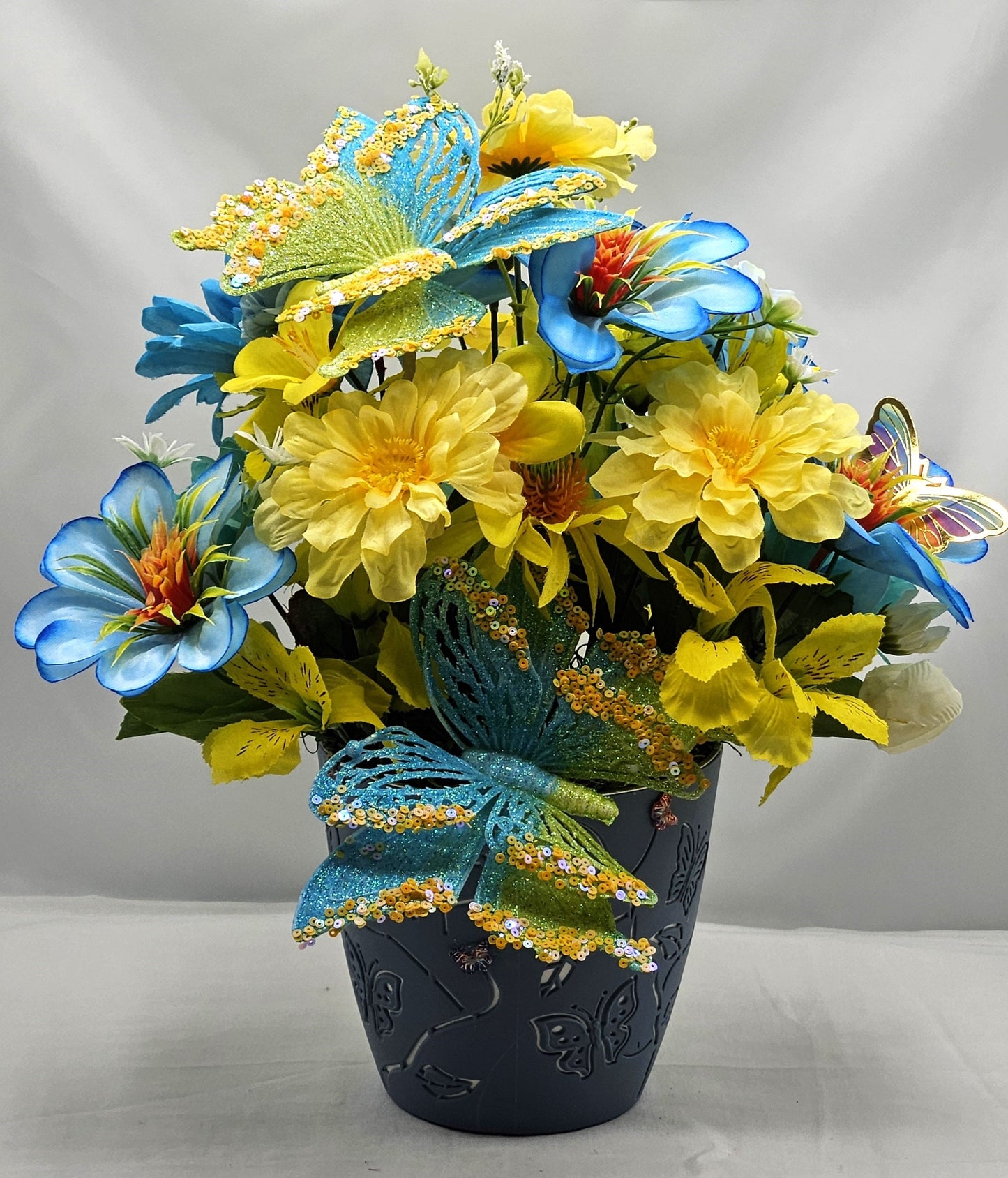 Butterfly Flower Arrangement, Sparkling Butterflies and Florals in Decorated Butterfly Pot, Yellow/Teal Blue Flowers & Butterfly Accents