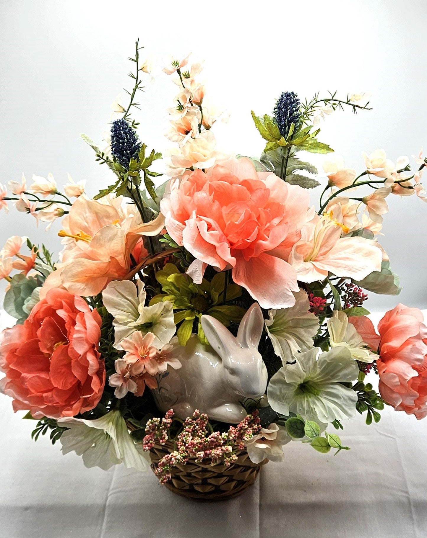 Elegant Spring Centerpiece with Bunny in Wicker Basket,  Peach and Jade Colored Peonies, Petunias and other Spring Flowers