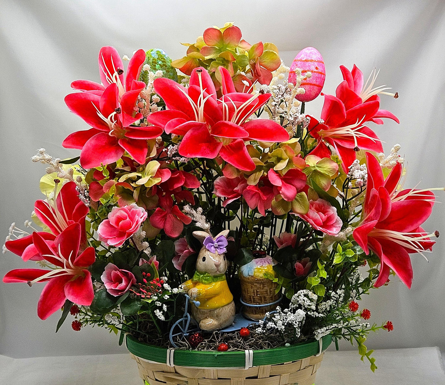 Whimsical Easter Basket/Rabbit in Bike Carrying Goodies/Accented W/cute Ladybugs/Hot Pink Lilies/Other florals/pink/green/Greens/Baby Breath