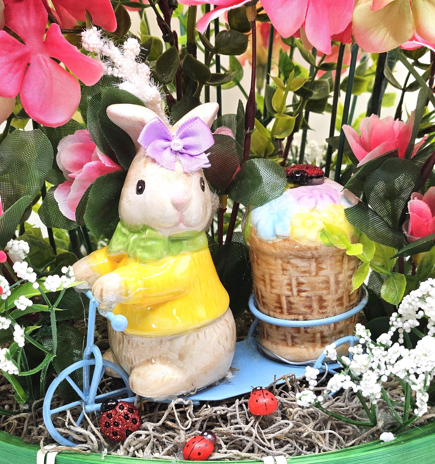 Whimsical Easter Basket/Rabbit in Bike Carrying Goodies/Accented W/cute Ladybugs/Hot Pink Lilies/Other florals/pink/green/Greens/Baby Breath