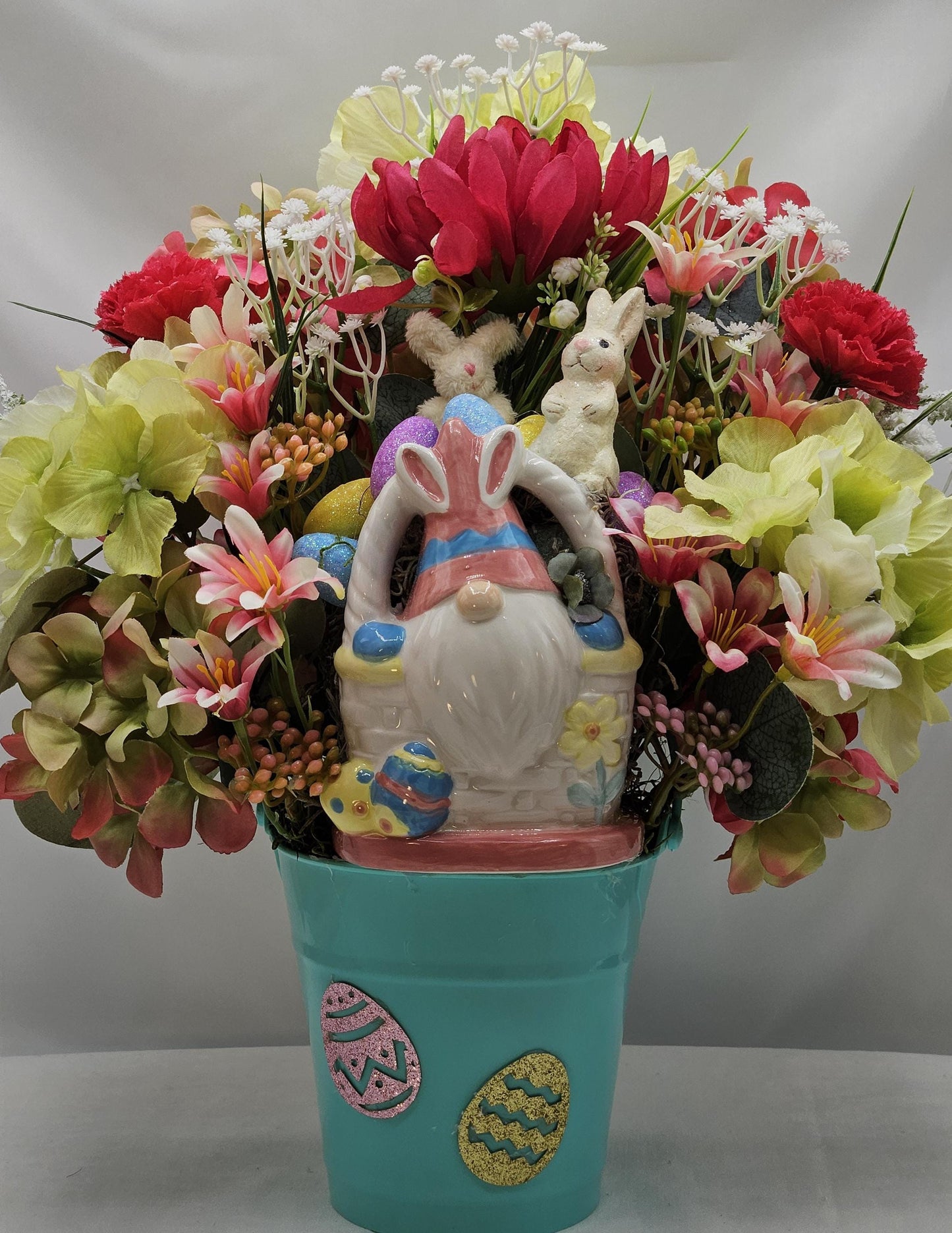 Bunny Gnome in Ceramic Basket within Floral Arrangment of Pink/Green Hydragena, Babys Breath, Easter Eggs, Holiday Accents/Blue Plastic Pail