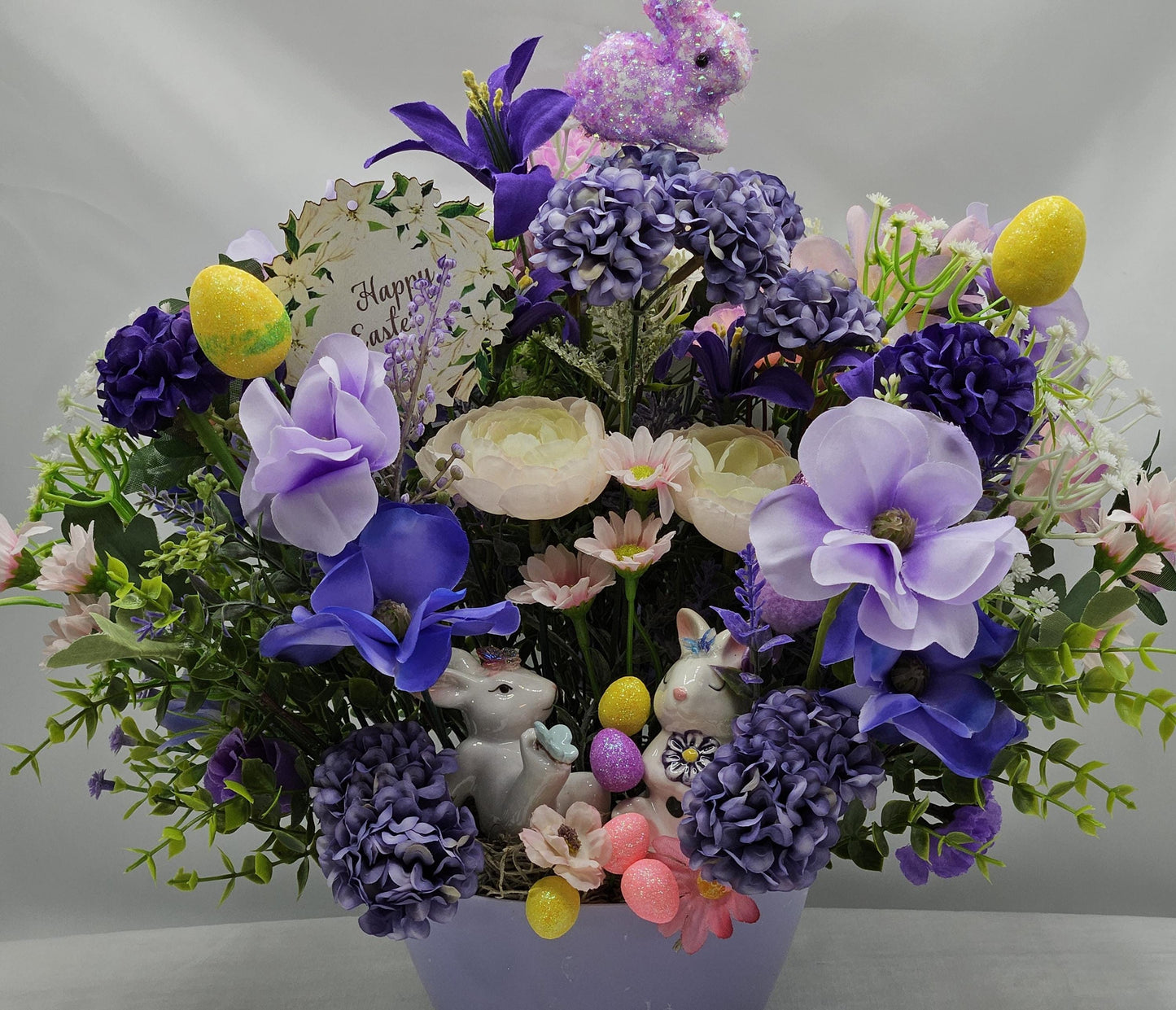 Easter/Spring Flower Arrangement/Purples/Lilac Flowers/Greenery/Cute Bunny Couple/Glittery Eggs/Happy Easter Sign/Easter Accens/Lilac Dish
