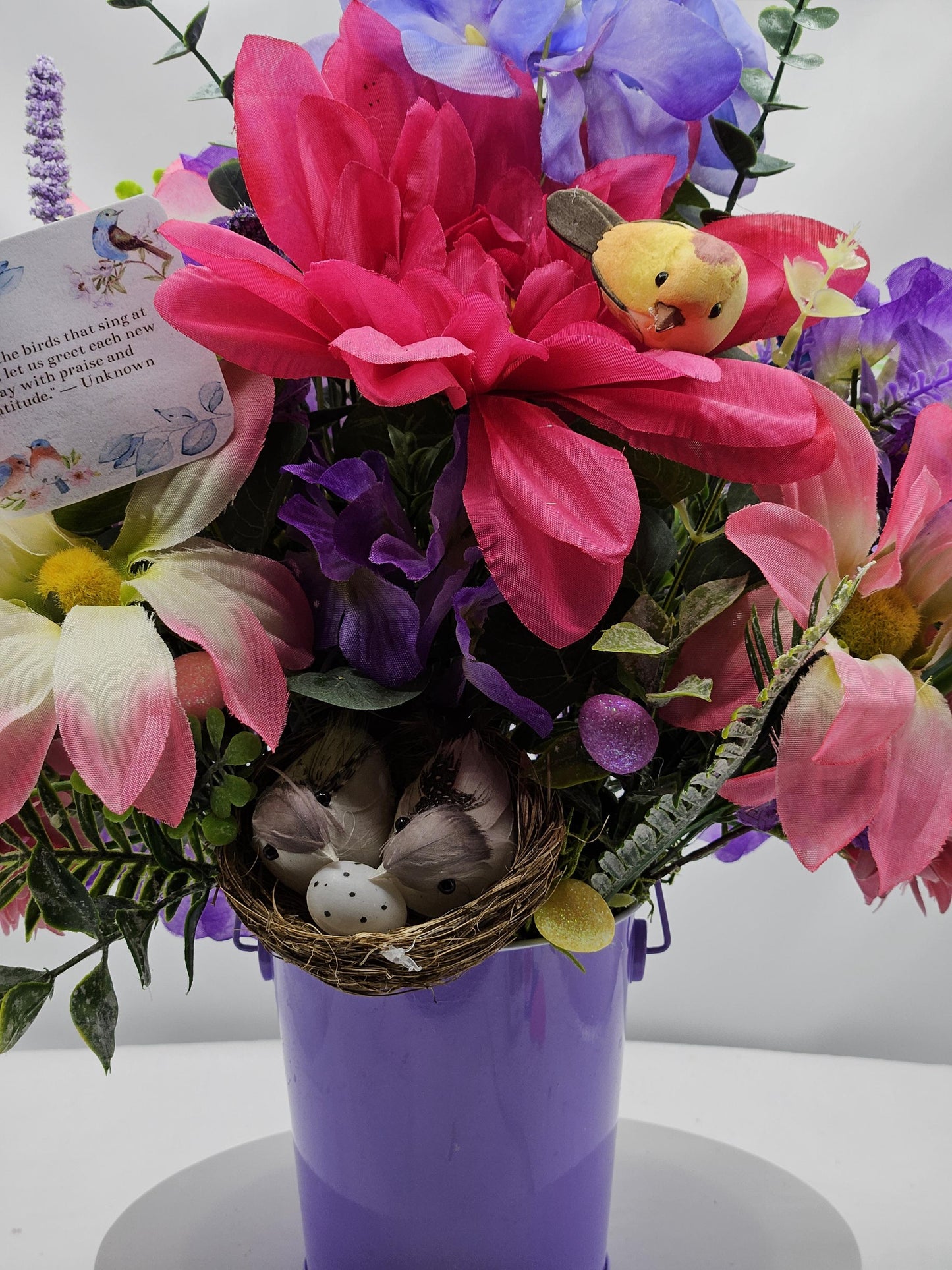 Charming Thinking Of You Bouquet set in a light purple container and accented with birds in a nest and/Atop Flowers/Pink/White/Blue/Greenery