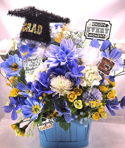 Graduation Floral Centerpiece/Blue Wood Basket/Blue/White/Yellow Flowers/Graduation Hat/Congratulations Messages/Roses/Dahlias/Pansies Plus