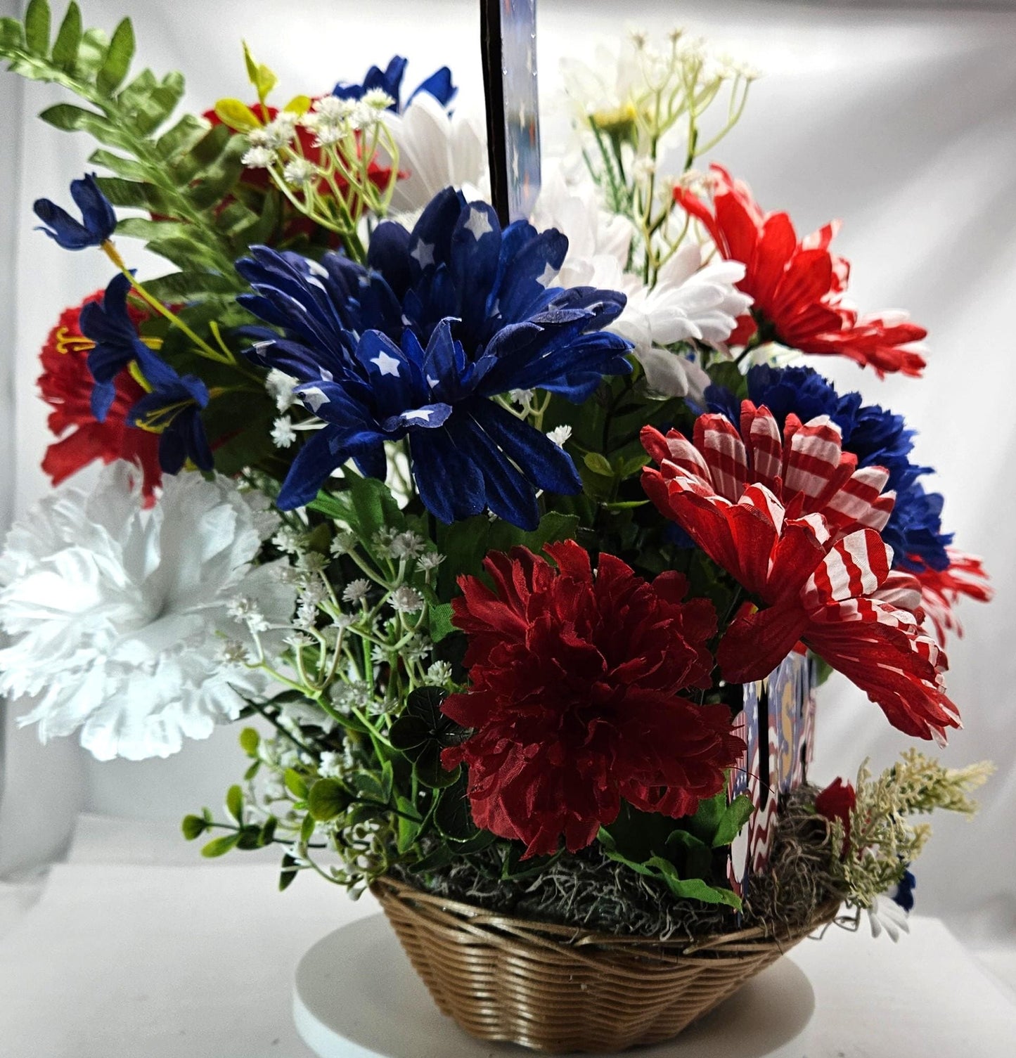 Gnome in the USA Patriotic Flower Arrangement, Oval Wicker Basket, Red White Blue Daisies, Sunflowers, Carnations