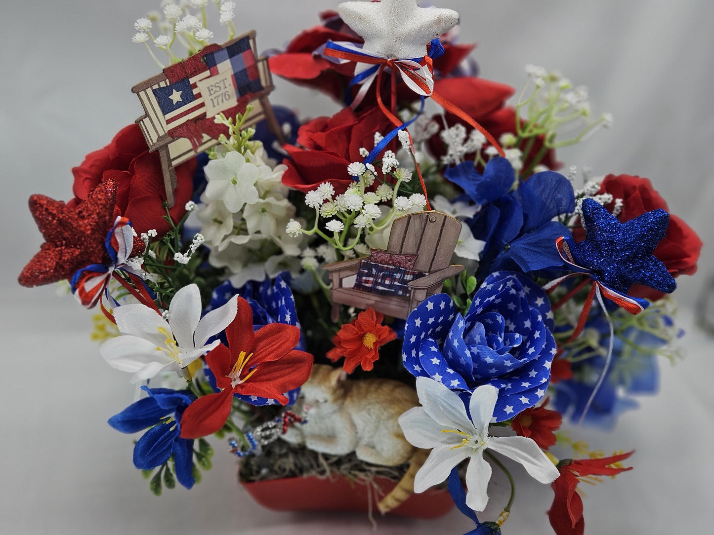 Patriotic Cat Floral Arrangement – Belly-Up Kitten or Lying Cat in Star Dish with Red White Blue Flowers