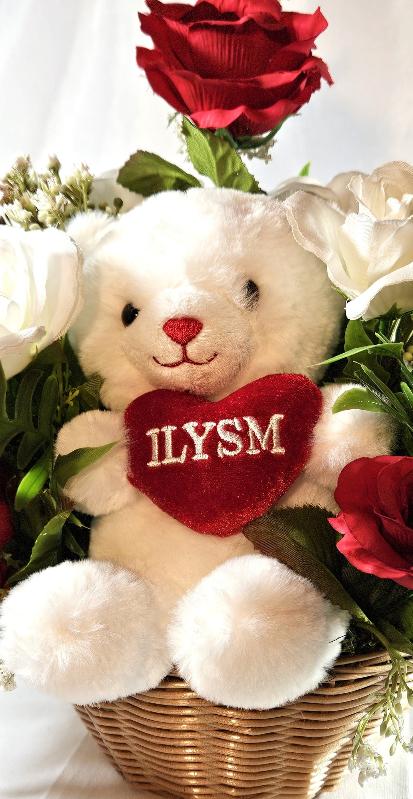 Adorable ILYSM Heart Bear Valentine Flower Arrangement - Red and White Roses and Baby's Breath in a Basket