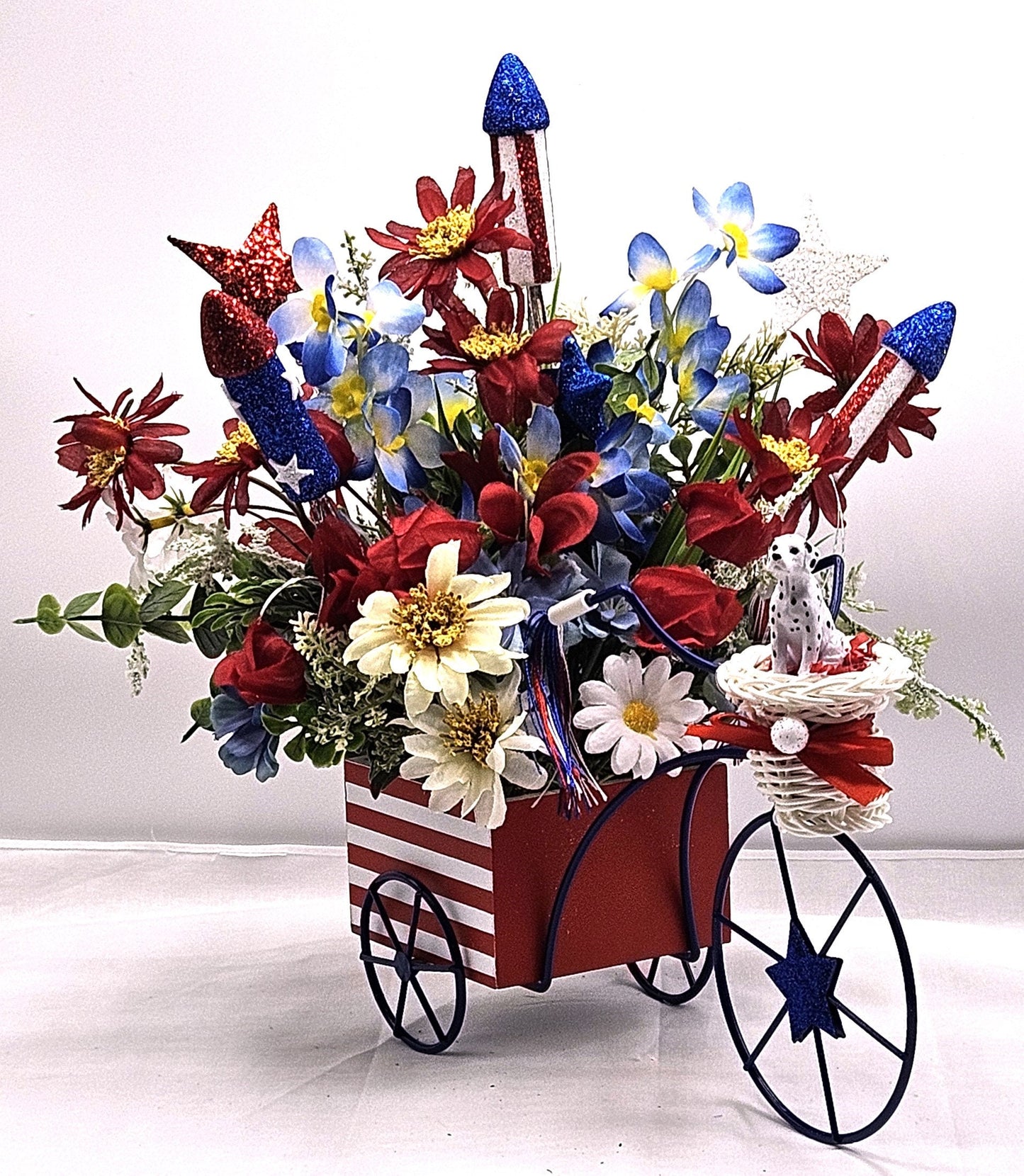 Americana Flower Arrangement Set in Bicycle Container with Red/White/Blue Flowers, sparkly Firecrackers and Stars, Basket with Dalmatian Dog