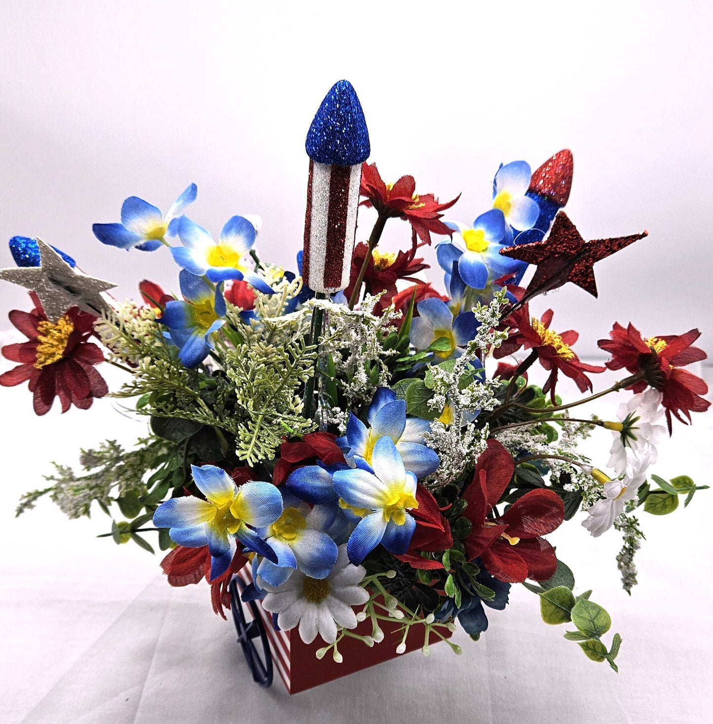 Americana Flower Arrangement Set in Bicycle Container with Red/White/Blue Flowers, sparkly Firecrackers and Stars, Basket with Dalmatian Dog