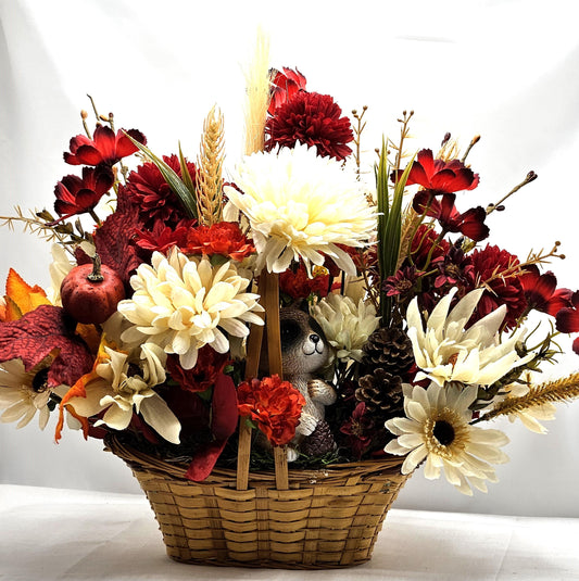 Deep Red and White Mums, Daisies, Other Wildflowers/Fall Leaves/Woodland Raccoon, Set in Handle Wicker Basket, Fall/Autumn Accents