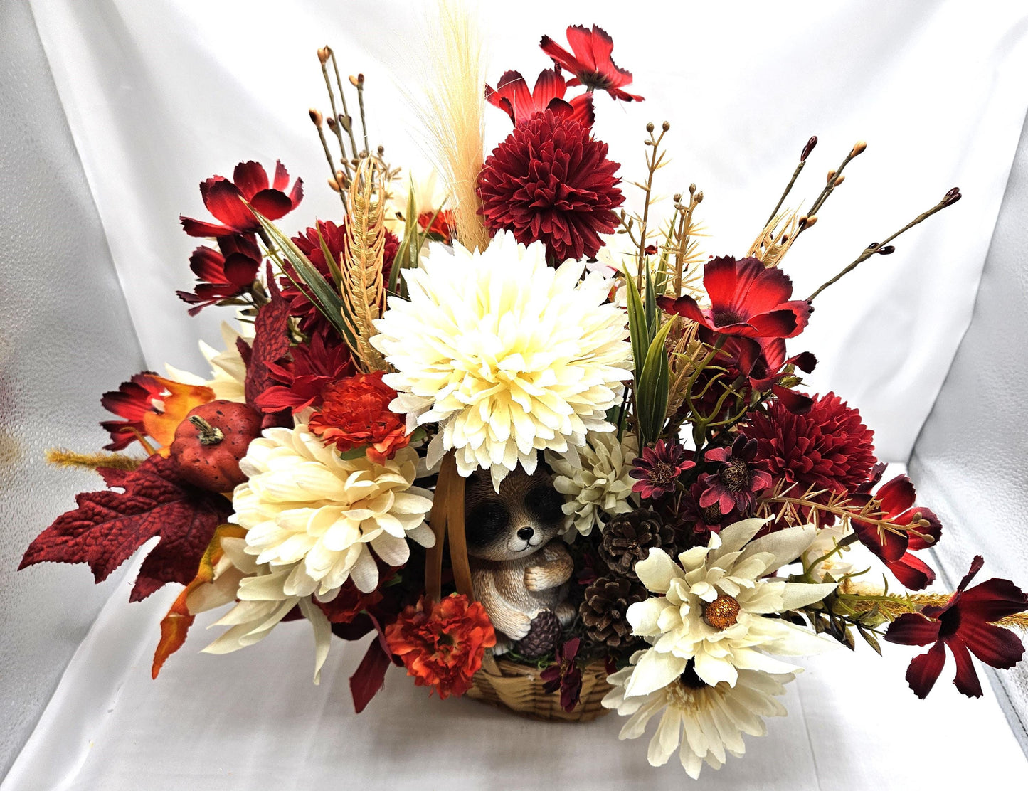 Deep Red and White Mums, Daisies, Other Wildflowers/Fall Leaves/Woodland Raccoon, Set in Handle Wicker Basket, Fall/Autumn Accents