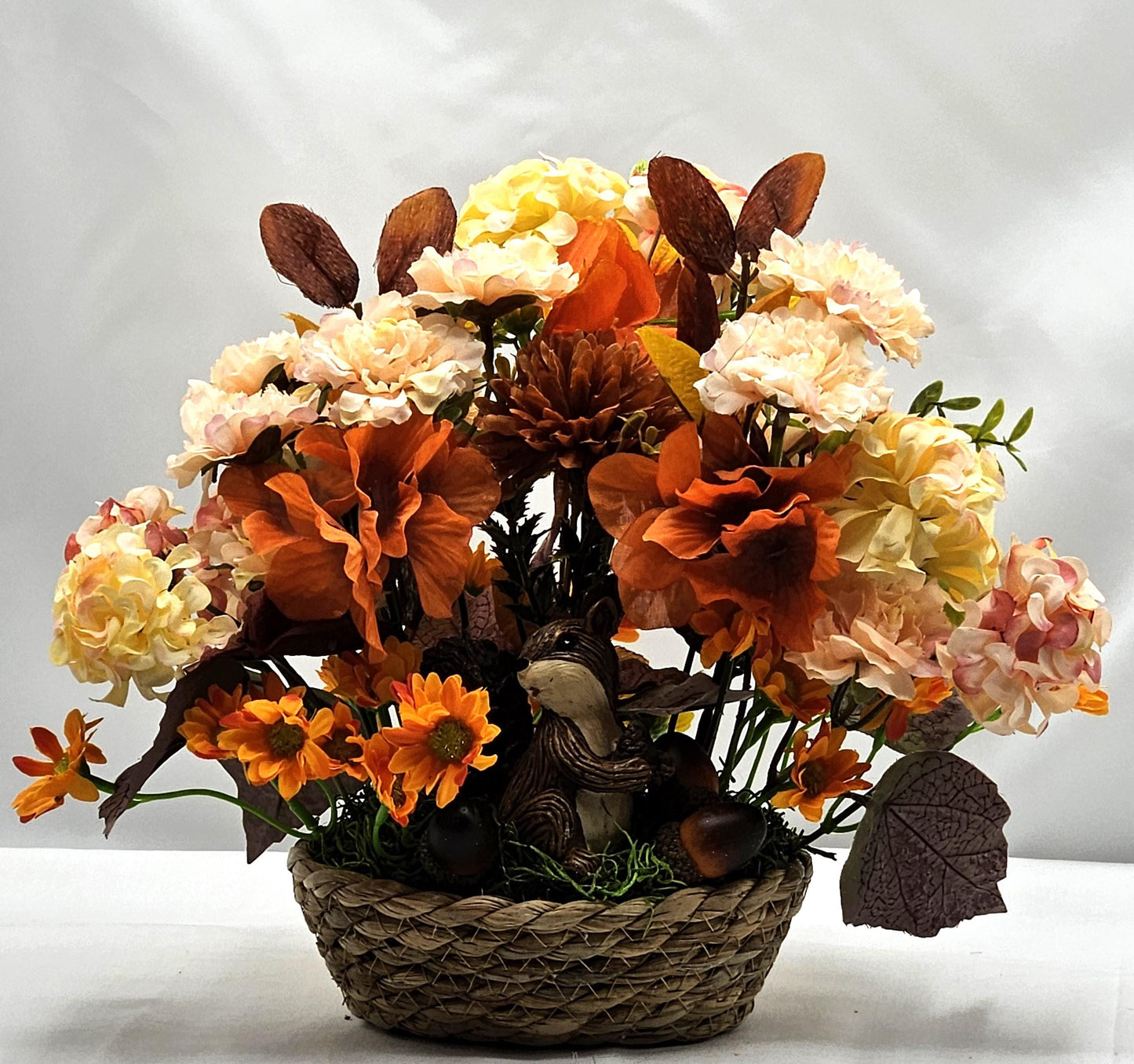 Enchanting Flower Arrangement of Burnt Orange/Orange Fall Flowers/Leaves/Acorns/Charming Ceramic Squirrel, All in a Simple Woven Basket
