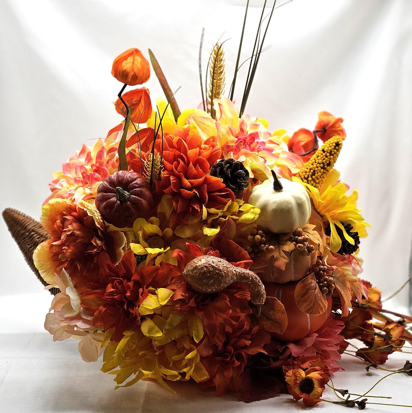 Elegant Thanksgiving Cornucopia with Orange and Yellow flowers, leaves, grasses, gourd and other Accents as Holiday Decor or Give as a Gift