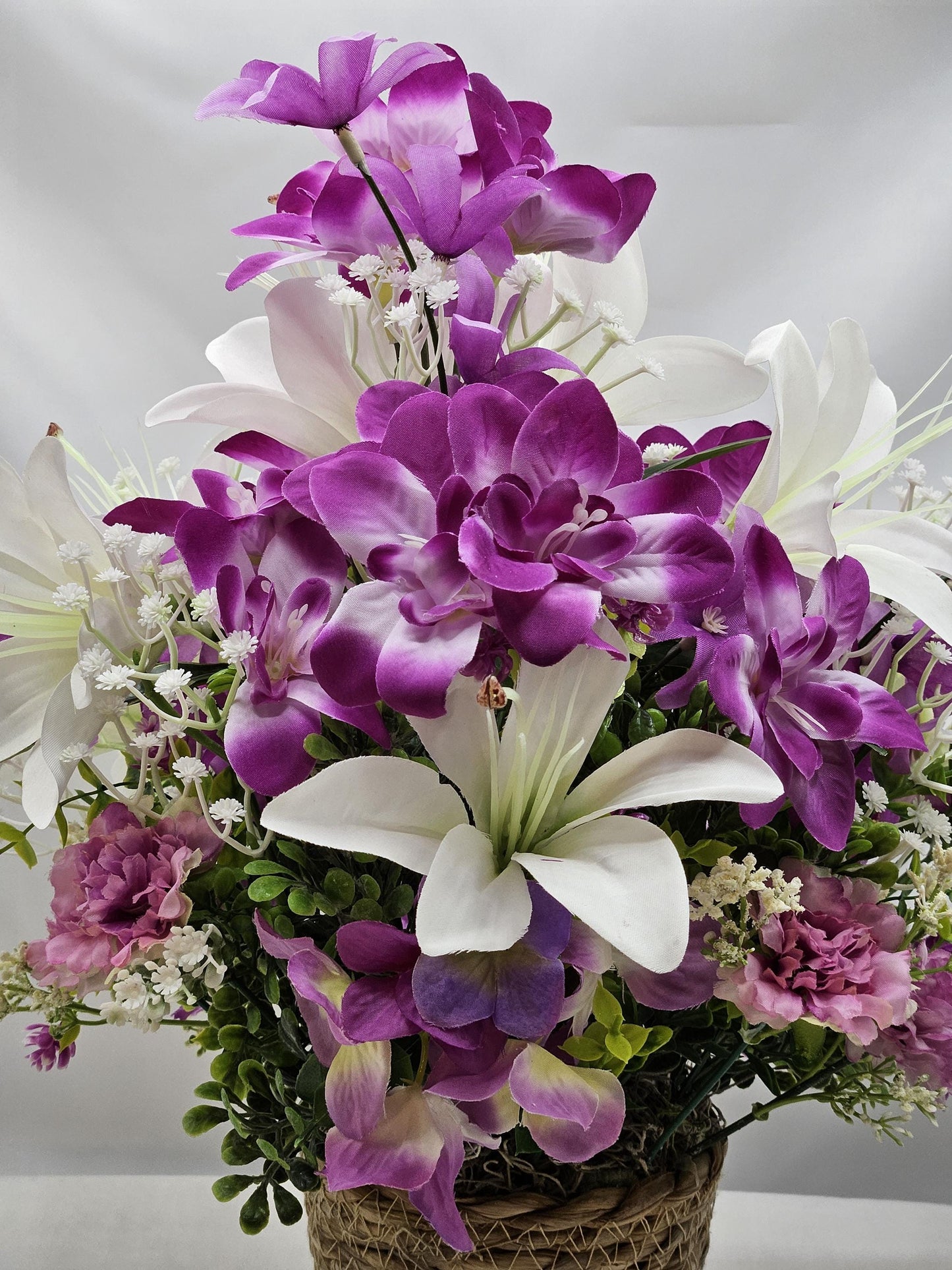Amazing Grace Elegant Floral Arrangement Featuring a White Wooden Cross Nestled Amidst a Garden of White Lilies/Purple Orchids/wicker Basket