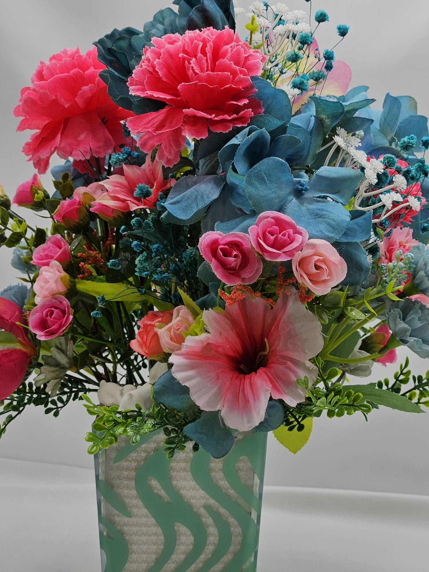 A Chilling Polar Bear Foral Centerpiece Set in Teal Striped Plastic Pot, Teal/Aqua/Pink Roses, Carnations/Other FloralsBaby's Breath