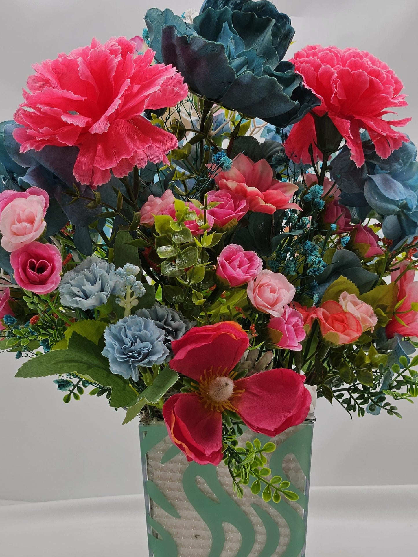 A Chilling Polar Bear Foral Centerpiece Set in Teal Striped Plastic Pot, Teal/Aqua/Pink Roses, Carnations/Other FloralsBaby's Breath