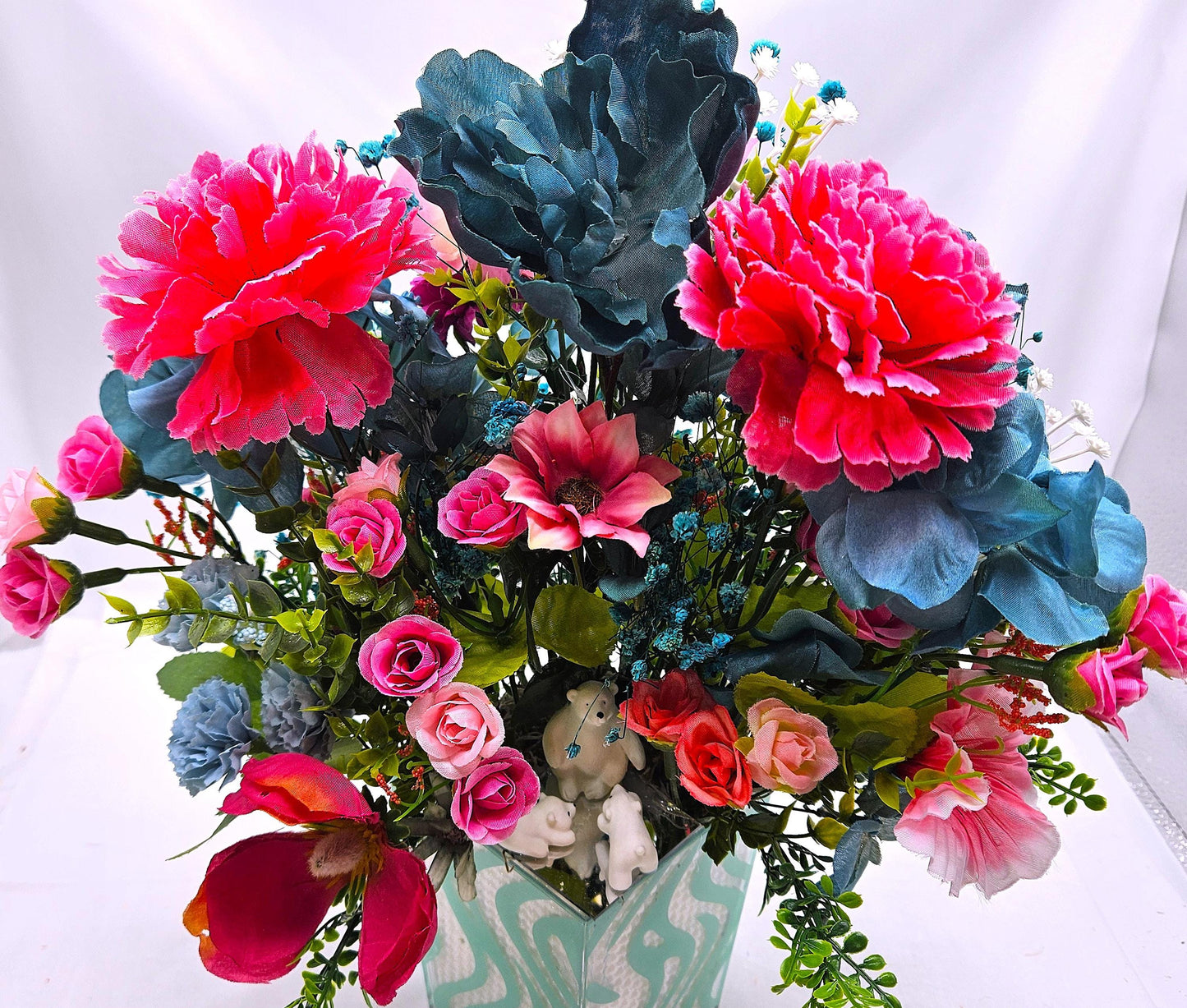 A Chilling Polar Bear Foral Centerpiece Set in Teal Striped Plastic Pot, Teal/Aqua/Pink Roses, Carnations/Other FloralsBaby's Breath