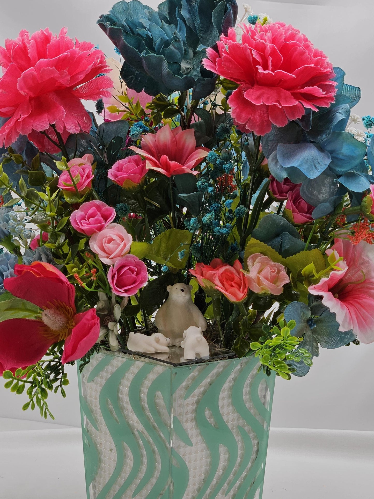 A Chilling Polar Bear Foral Centerpiece Set in Teal Striped Plastic Pot, Teal/Aqua/Pink Roses, Carnations/Other FloralsBaby's Breath