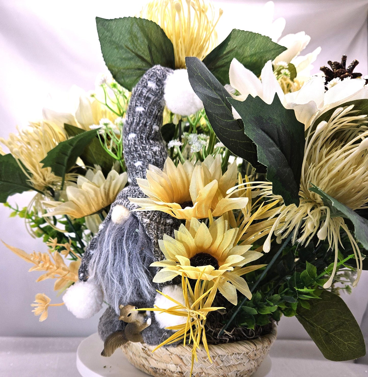 Cheerful Gray Gnome Sitting in Fall Garden of White Spider Mums/Sunflowers/Daisies/Pumpkinsa/Fall Leaves/Other Fall Accents/Woven Basket