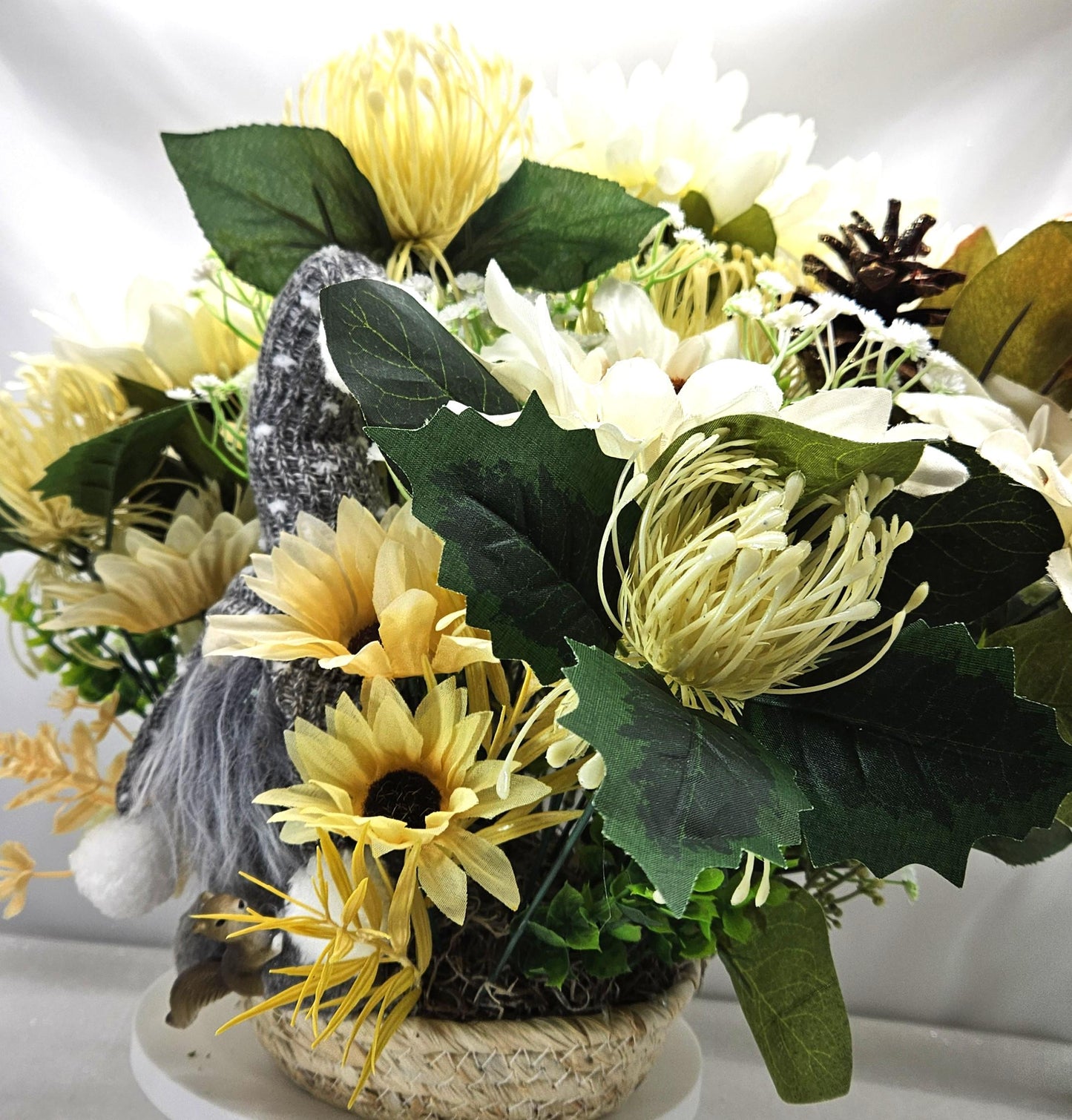 Cheerful Gray Gnome Sitting in Fall Garden of White Spider Mums/Sunflowers/Daisies/Pumpkinsa/Fall Leaves/Other Fall Accents/Woven Basket